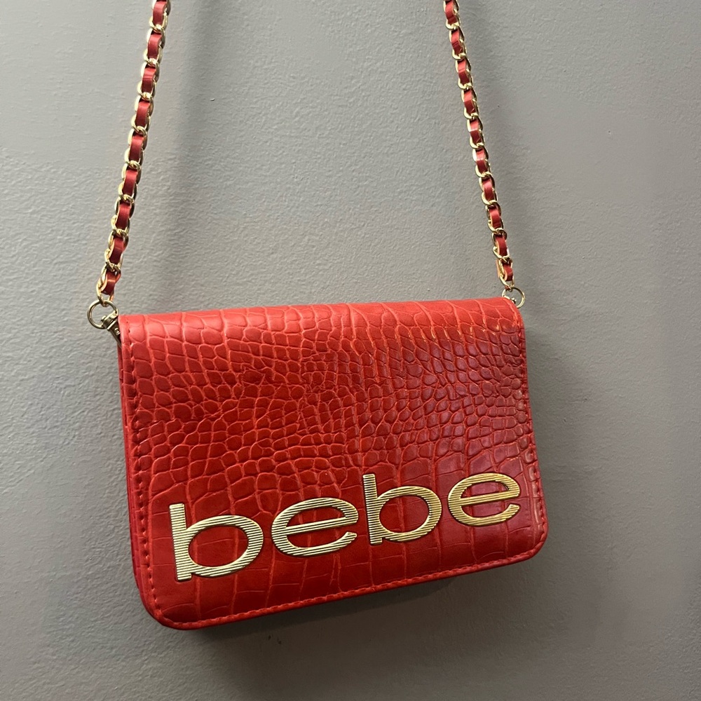 Bebe Red and Gold Crossbody Bag with Chic Design